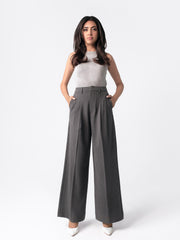 Low-rise black wide leg pants with a fitted belt, pleats, and multiple pockets, designed for a formal and smart look.